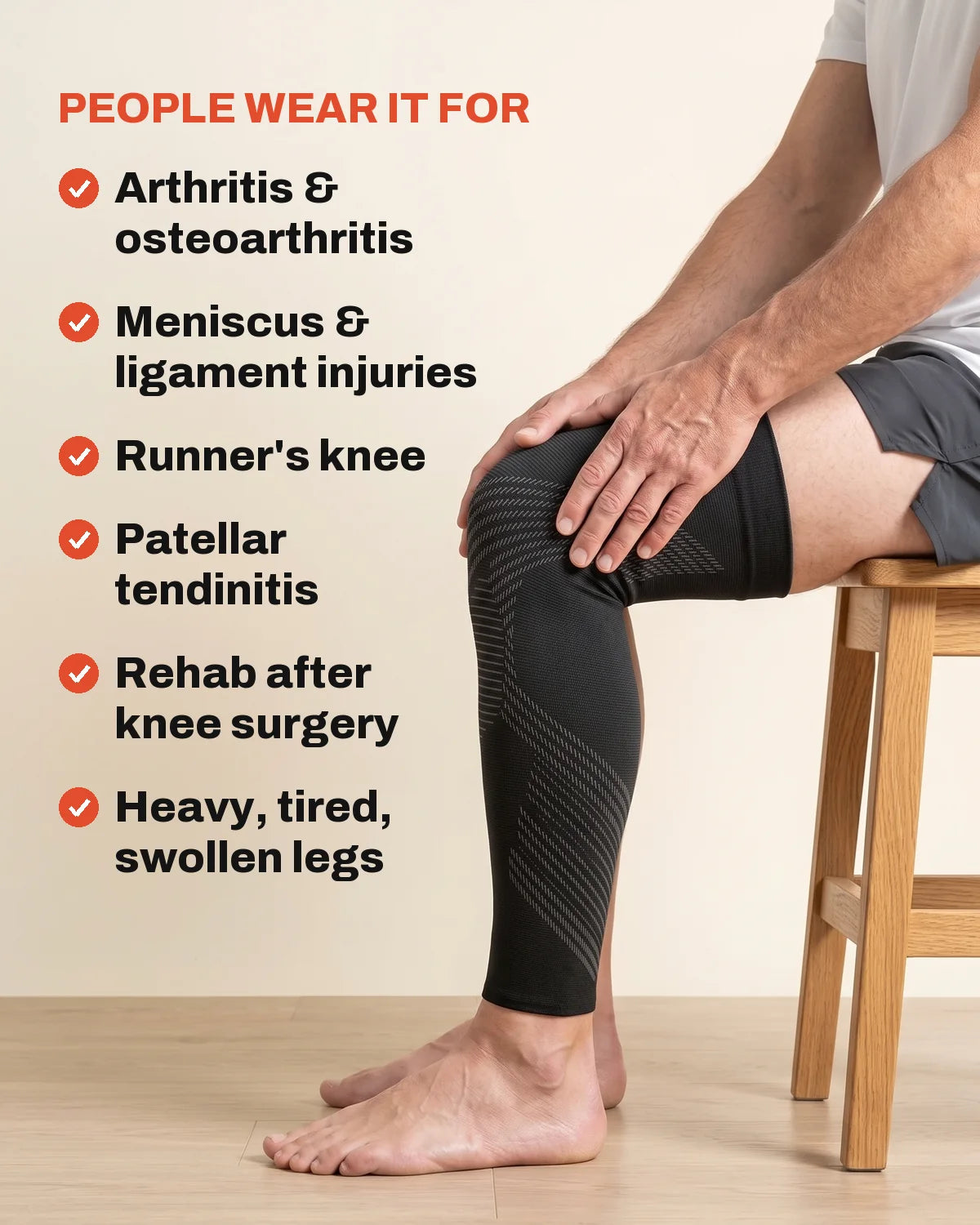 Man seated with his hands on his knee, wearing the TORVELL KNEE 01 full-leg knee compression sleeve. People wear it for arthritis and osteoarthritis, meniscus and ligament injuries, runner's knee, patellar tendinitis, rehab after knee surgery, and heavy, tired, swollen legs. Image