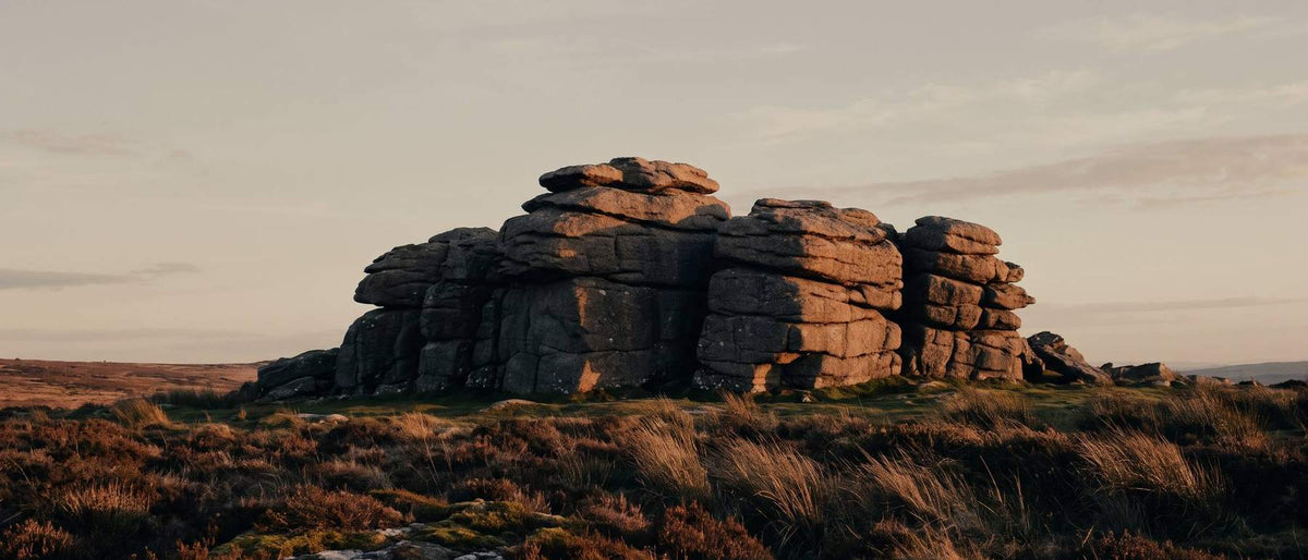 Granite tor on Devon moorland at golden hour